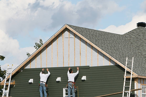 Professional Storm Damage Siding Repair technician working in Harborcreek, PA